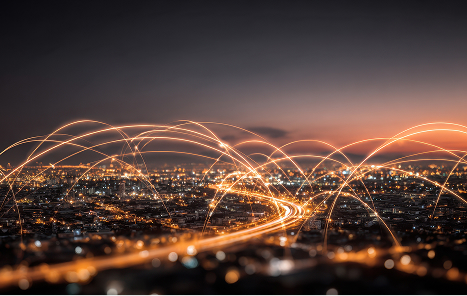 City skyline at night with connected trade routes